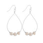 Long metal drop earrings with pearls