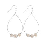Long metal drop earrings with pearls